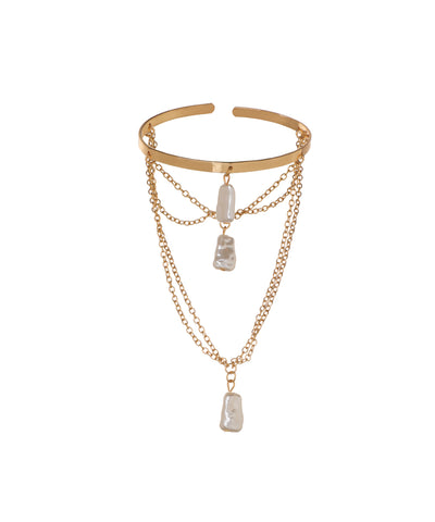Gold-tone arm cuff with multi-layered chains and baroque-style drops