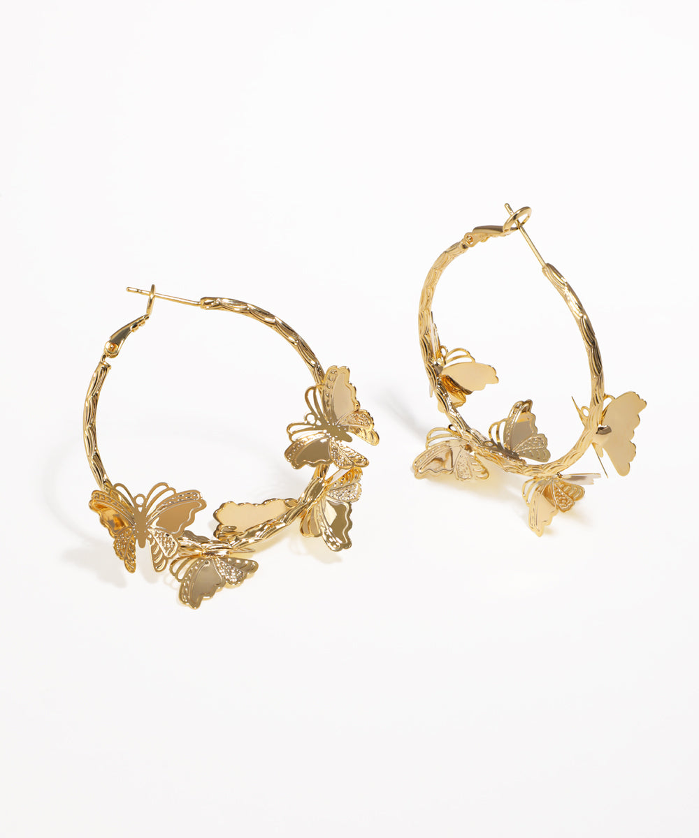 Gold-tone hoop earrings with multiple butterfly designs