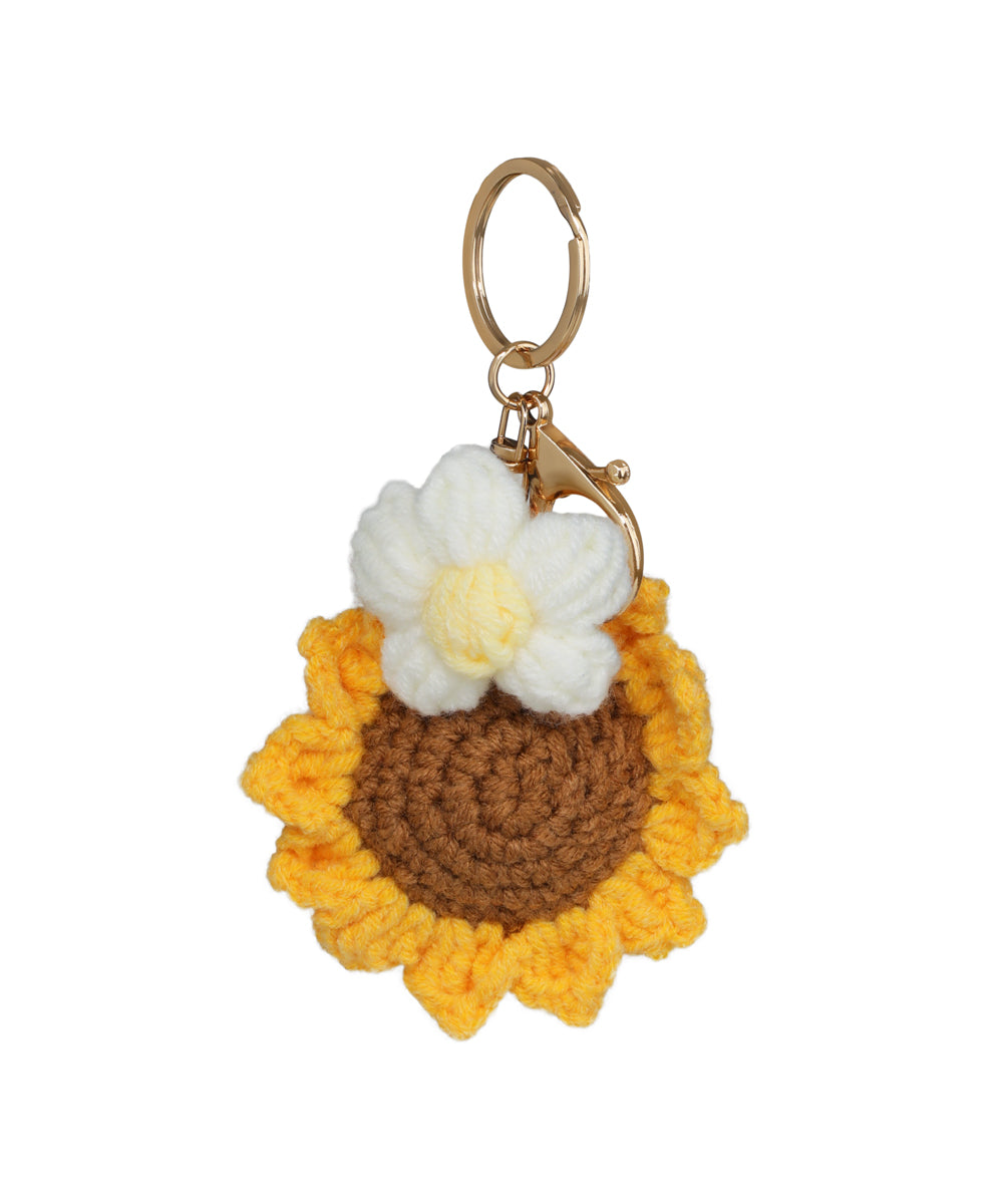 Gold-tone crochet keychain with sunflower and white flower design
