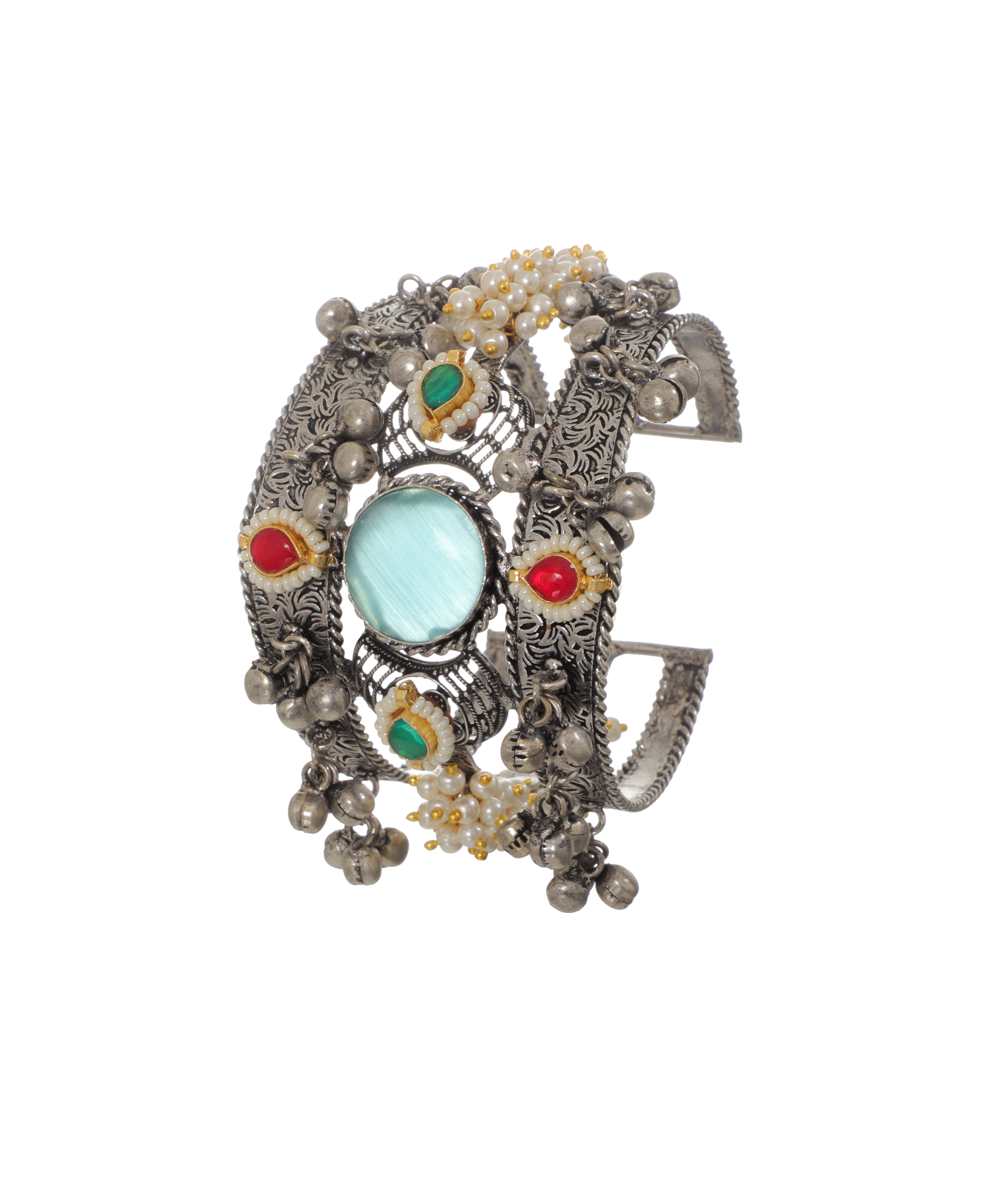 Oxidized silver-tone cuff bracelet with blue, red, green glass stones, faux pearls, and ghungroo bells.