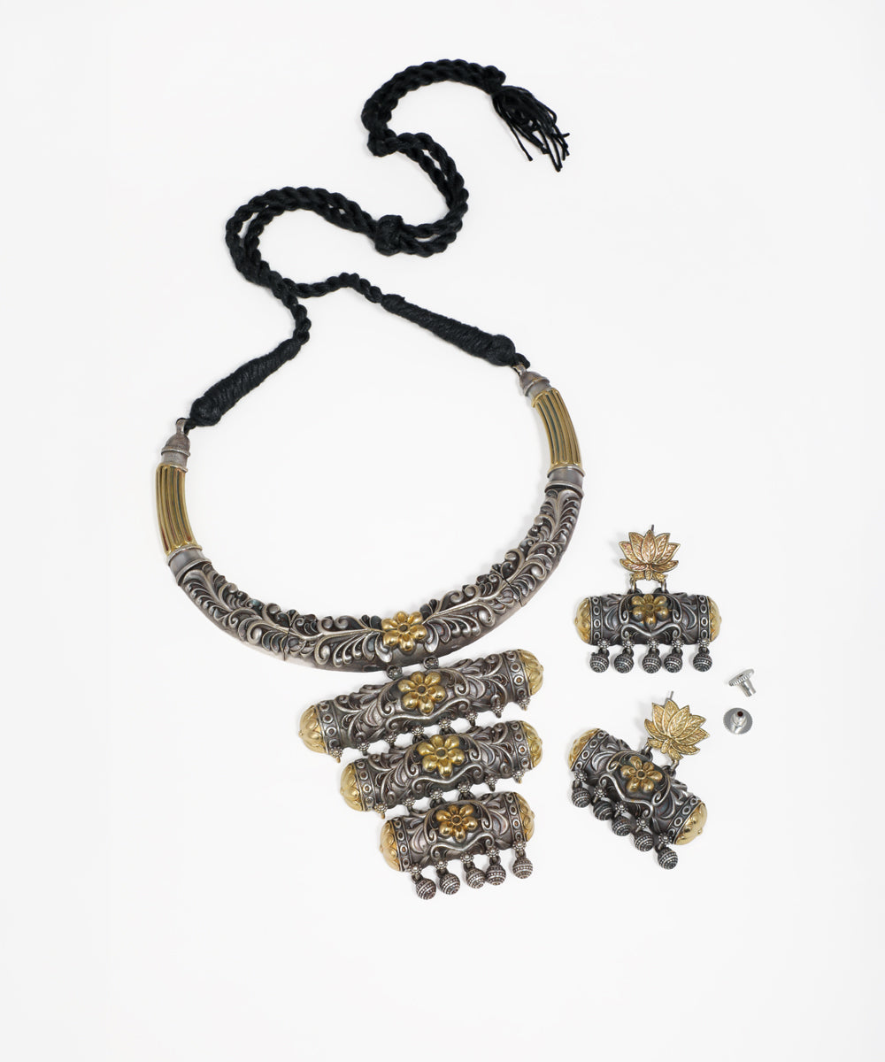 Oxidized silver-tone necklace set with brass-tone floral accents and matching drop earrings