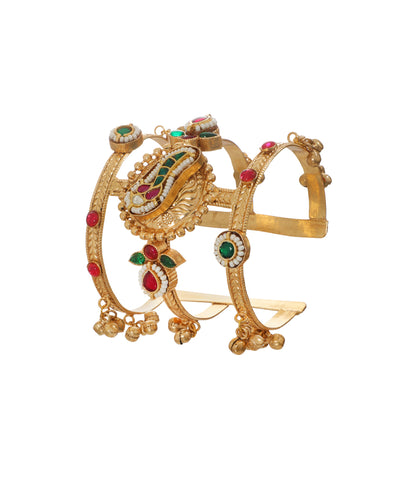 Gold-tone Oxidise cuff bracelet with red and green stones, faux pearls, and ghungroo details