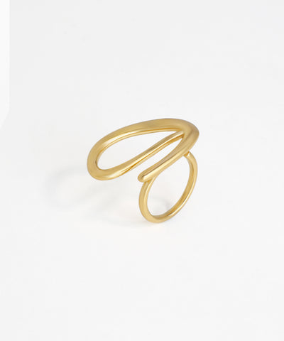 Gold-tone finish ring with a modern, sculptural open loop design