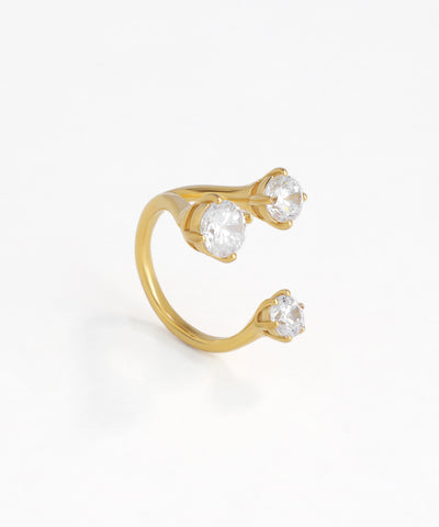 Gold-tone ring with three round clear stones in an open cuff design