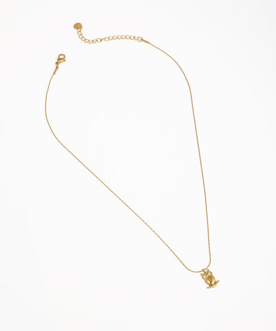 Gold-tone necklace with a small owl pendant and clear stone eyes