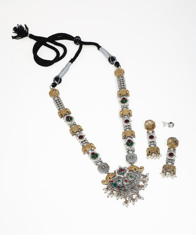 Oxidized silver-tone and gold-tone necklace set with elephant motifs, red and green stones, and faux pearls