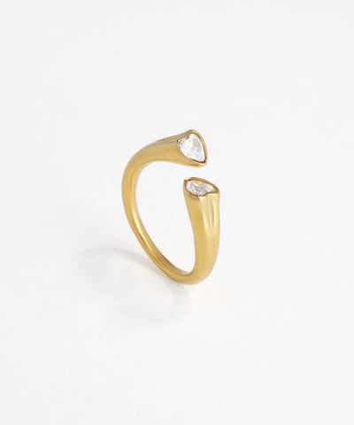 Gold-tone open ring with two heart-shaped cubic zirconia stones at each end