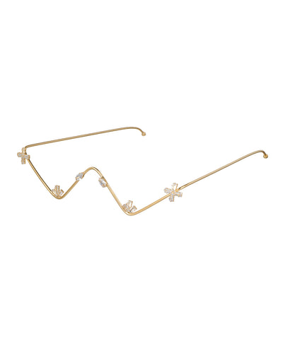 Gold-tone facelet with wavy frame and sparkling starburst stone details