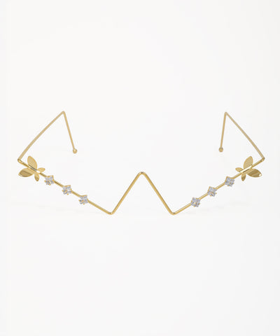 Gold-tone facelet with zig-zag design, butterfly accents, and small clear stones