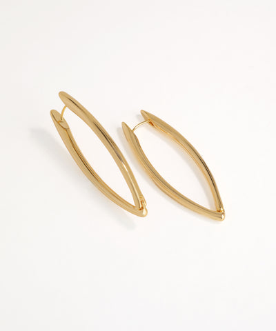 Gold hoop oval earrings on a white background