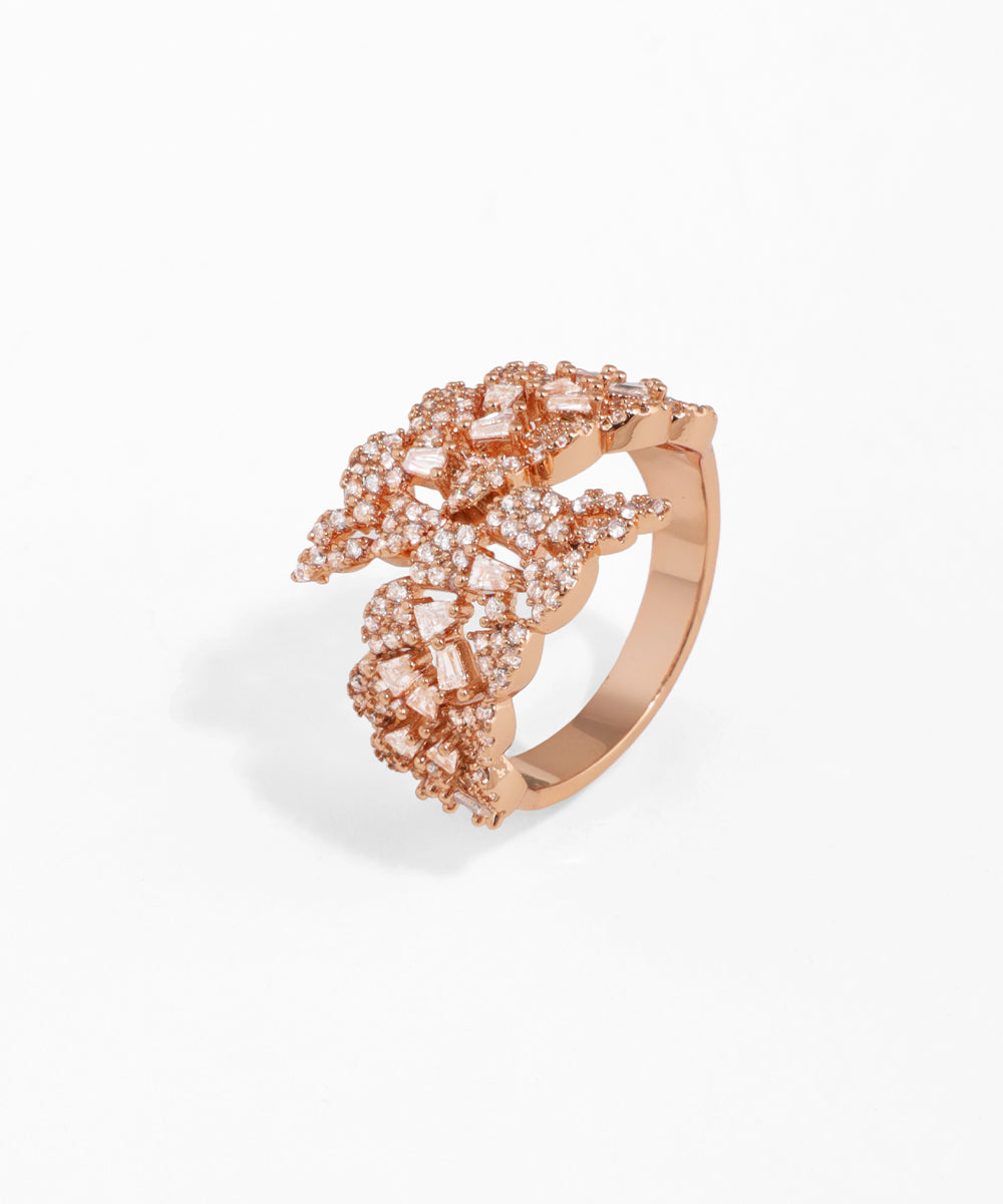 Rose gold ring with gemstones on a white background