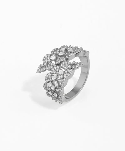 Silver ring with floral design on a white background