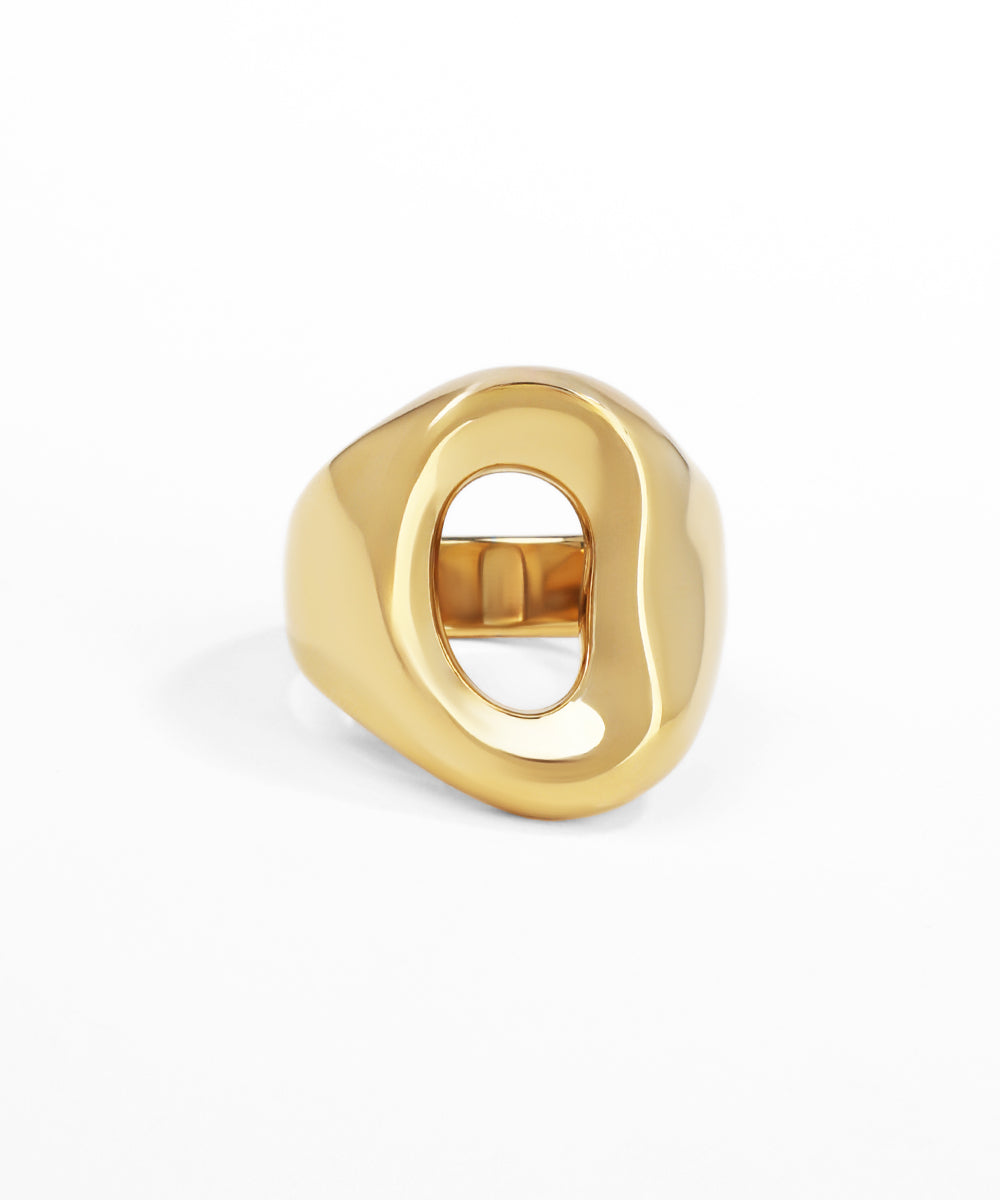 Gold ring with a unique design on a white background