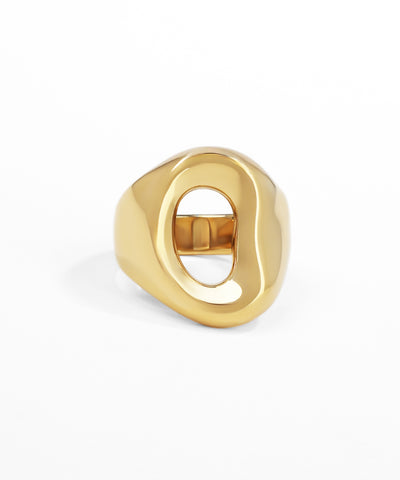 Gold ring with a unique design on a white background