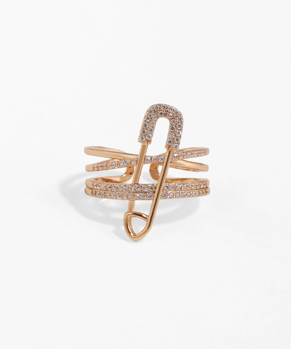 Rose gold ring with a unique design on a white background
