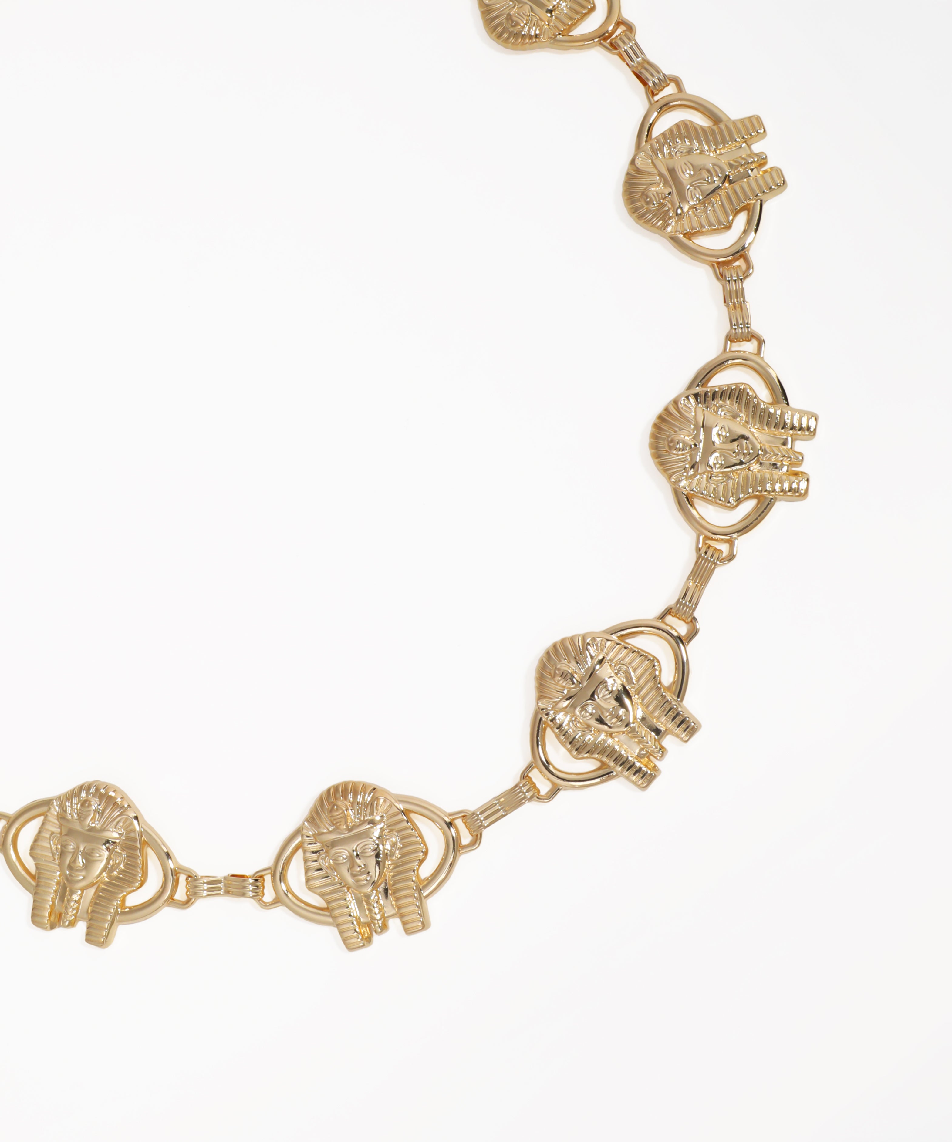 Gold elephant head bracelet on a white background