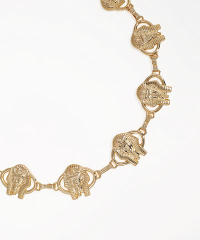 Gold elephant head bracelet on a white background