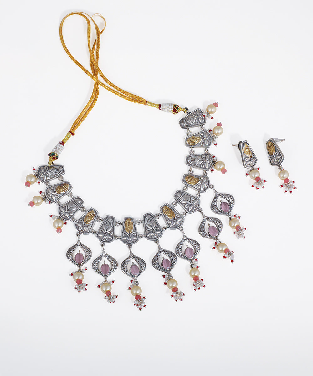 Oxidized silver-tone necklace set with gold-tone floral panels, faux pearls, and pink stone drops