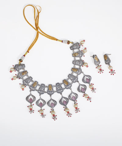 Oxidized silver-tone necklace set with gold-tone floral panels, faux pearls, and pink stone drops