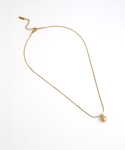 Gold necklace with a pearl pendant on a white background