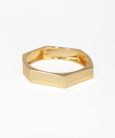 Gold-tone hexagonal geometric bangle kada with a polished finish