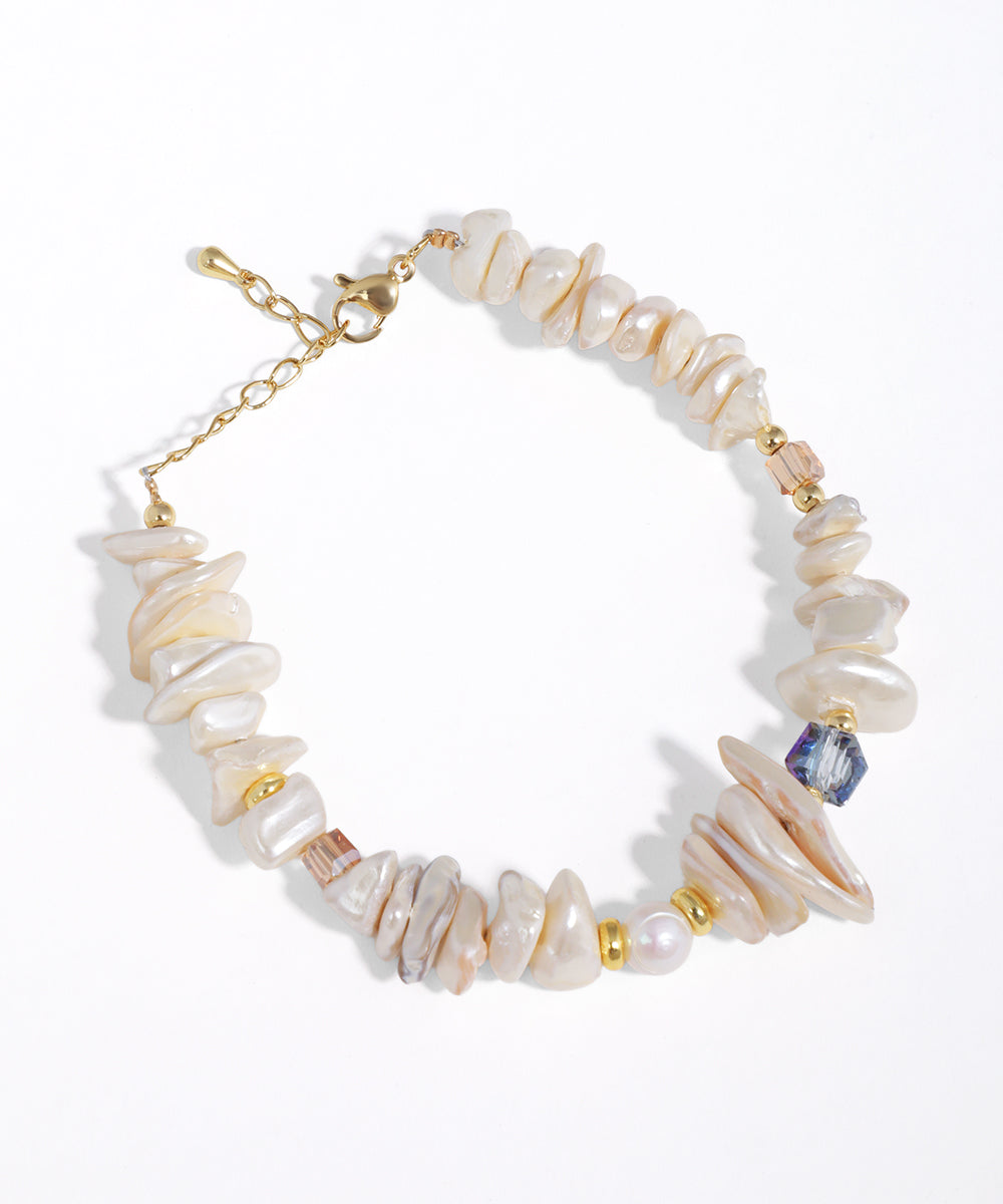 Gold-tone bracelet with irregular faux pearl chips and mixed glass crystal beads