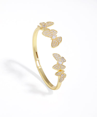 Gold-tone open cuff bracelet with embellished butterfly clusters