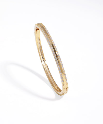 Gold-tone bracelet featuring two parallel rows of sparkling cubic zirconia