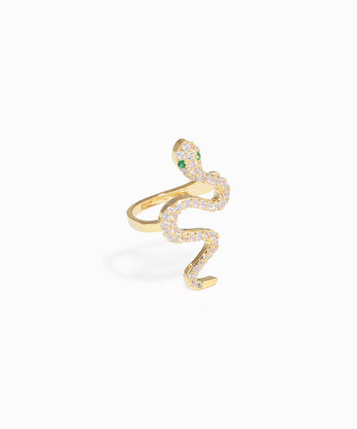 Gold snake-shaped ring with green gemstones on a white background