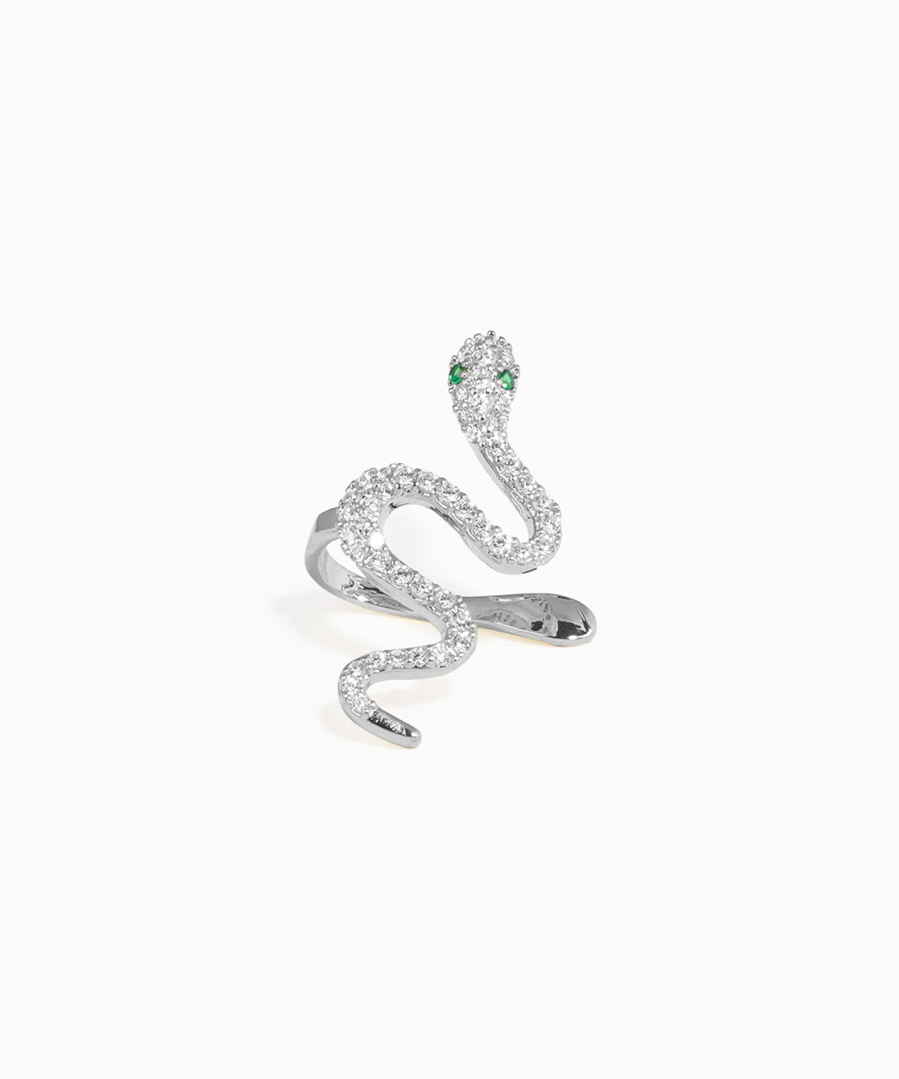 Silver snake-shaped earring with green gemstones on a white background