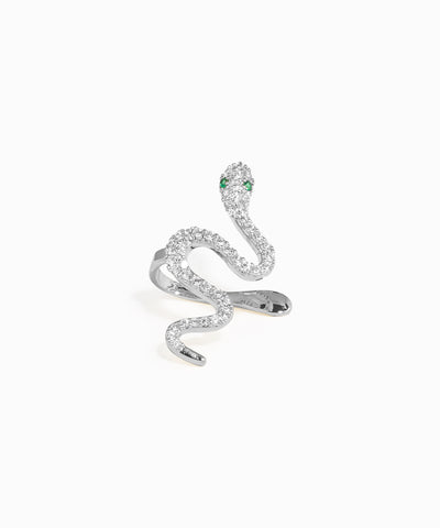 Silver snake-shaped earring with green gemstones on a white background