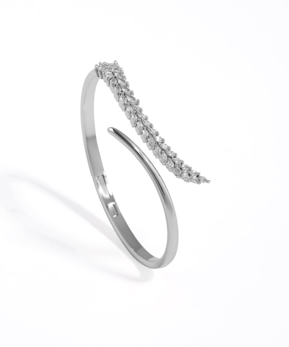 Silver bracelet with small stones on a white background