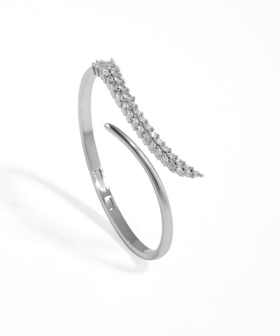 Silver bracelet with small stones on a white background