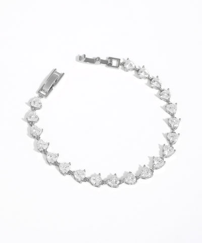 Silver bracelet with clear gemstones on a white background
