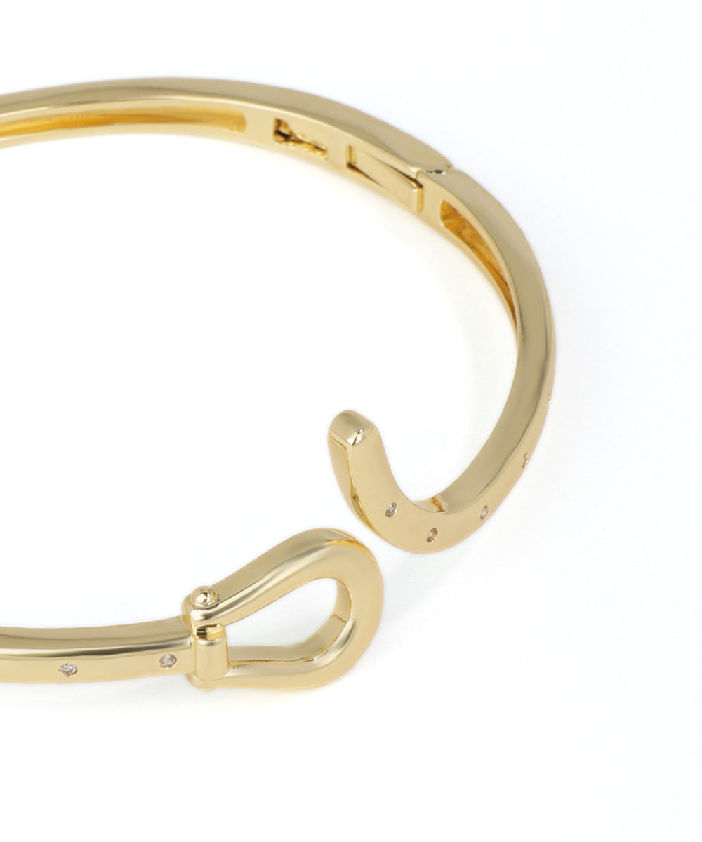 Gold bracelet on a white background