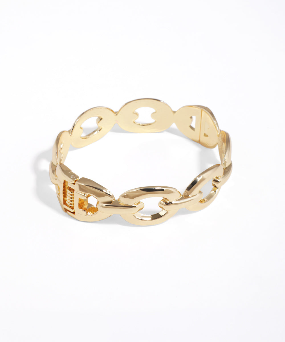 Gold chain-style ring on a white background
