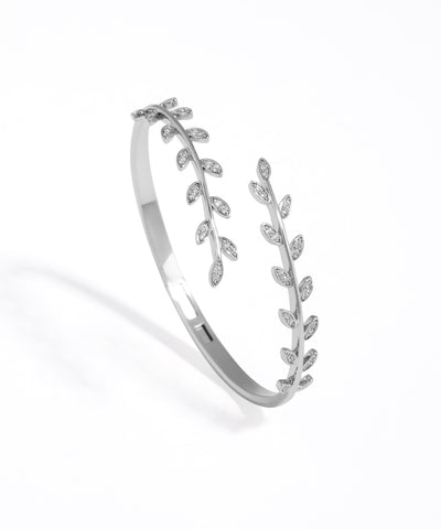 Silver bracelet with leaf design on a white background