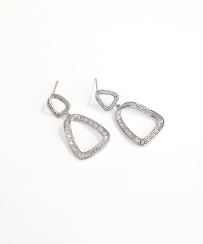 Silver teardrop earrings with clear stones on a white background