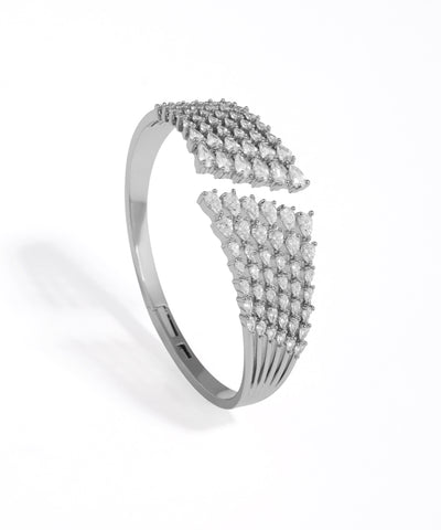 Silver bracelet with diamond accents on a white background