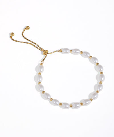 Gold-tone bracelet with oval faux pearl beads and a box chain slider closure