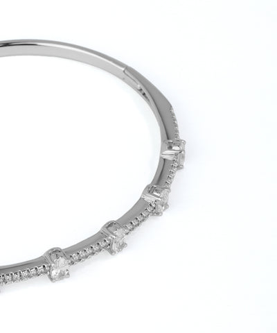 Silver bracelet with small diamonds on a white background