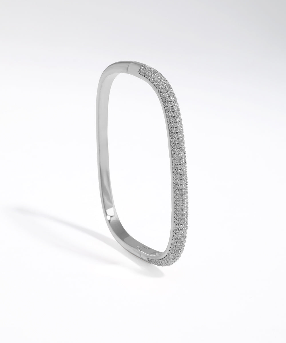 Silver bracelet with small stones on a white background