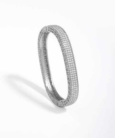 Silver bracelet with small stones on a white background