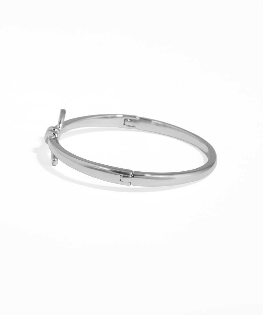 Silver hoop earring on a white background