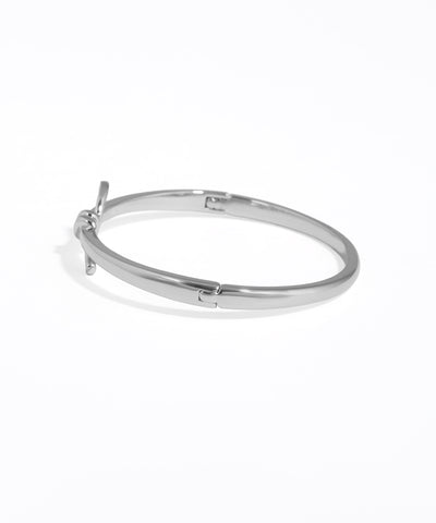 Silver hoop earring on a white background