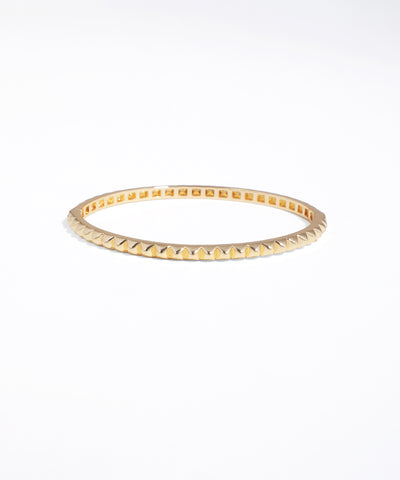 Gold bracelet on a white background
