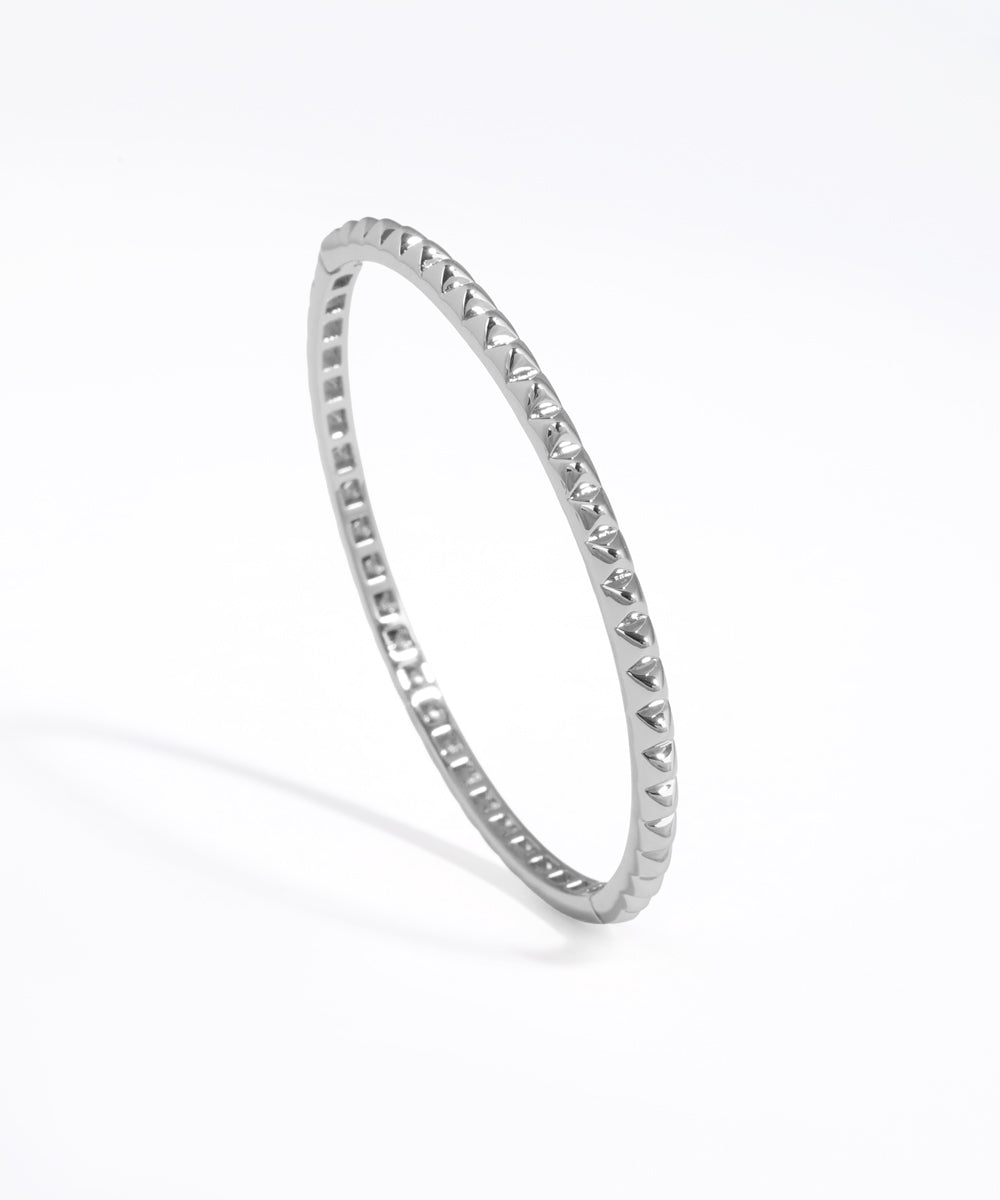 Silver ring with small stones on a white background