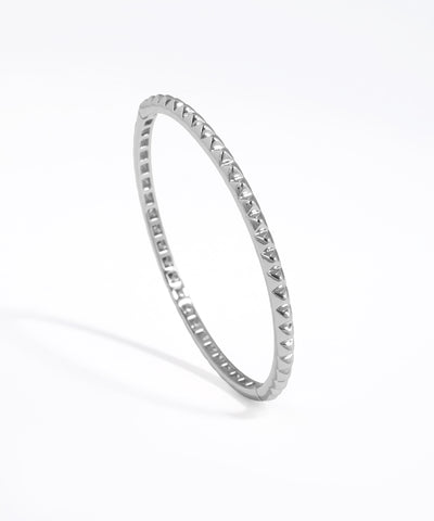 Silver ring with small stones on a white background