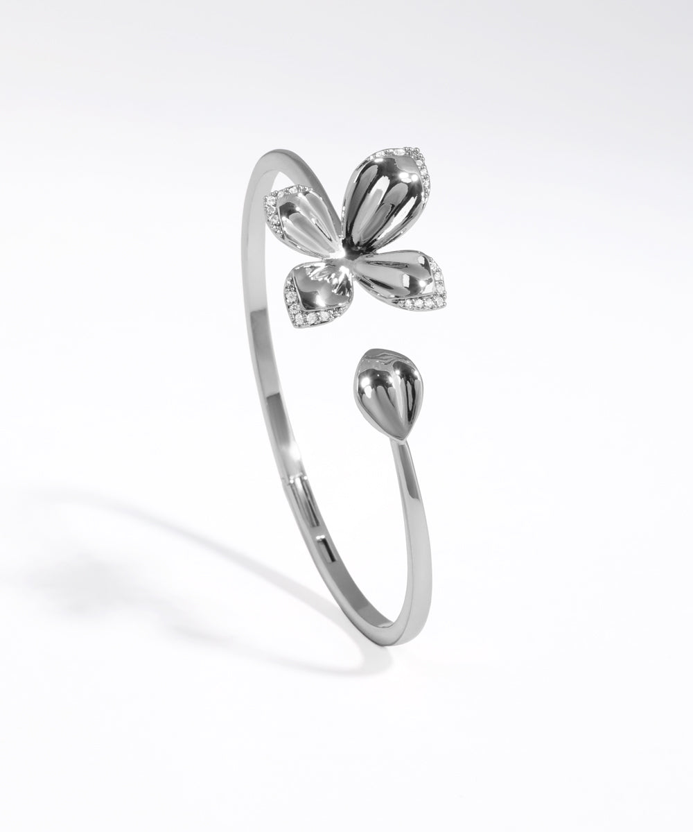 Silver butterfly-shaped ring on a white background