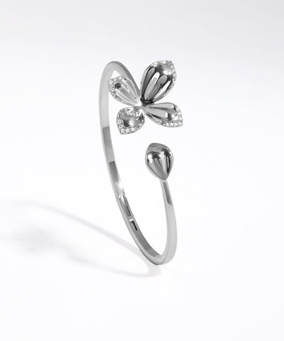 Silver butterfly-shaped ring on a white background